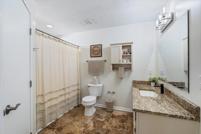 full bathroom featuring visible vents, toilet, a textured ceiling, vanity, and baseboards