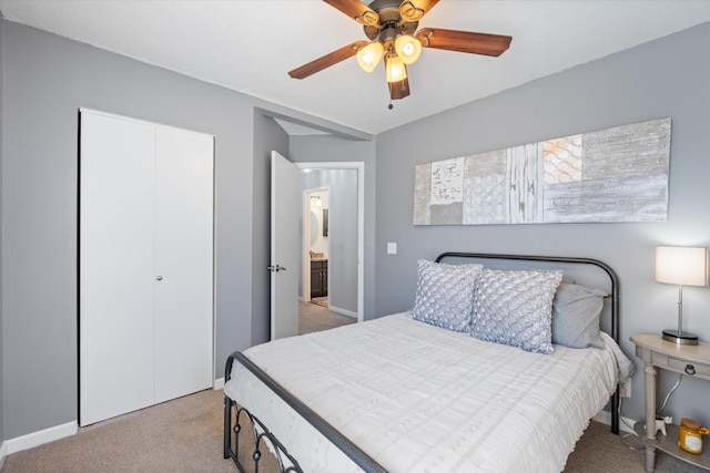 bedroom with ceiling fan, a closet, carpet, and baseboards