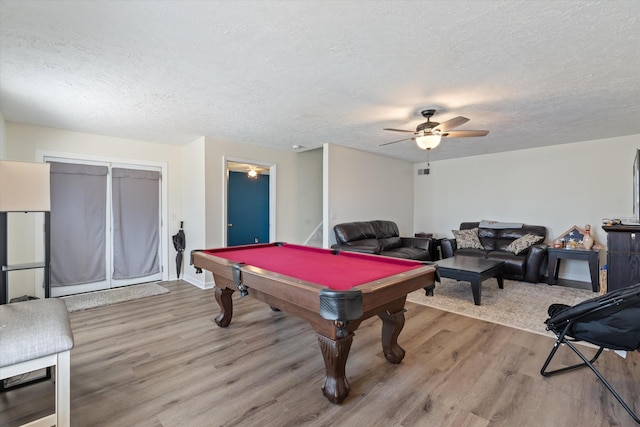 playroom with a ceiling fan, a textured ceiling, wood finished floors, billiards, and baseboards