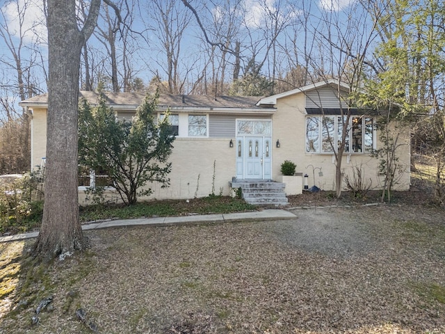 view of front of house with brick siding