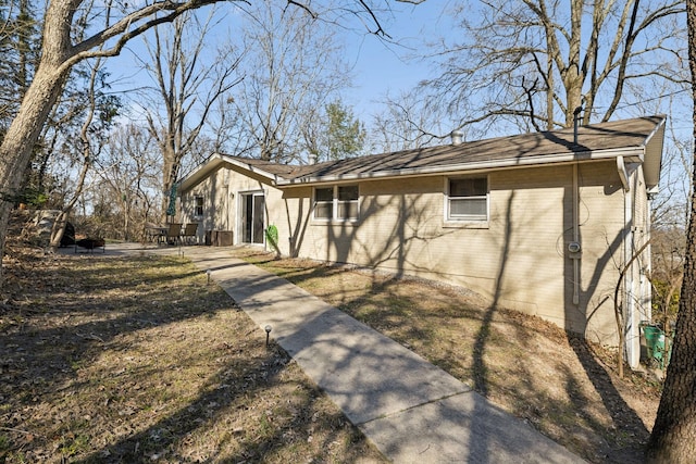 exterior space with brick siding