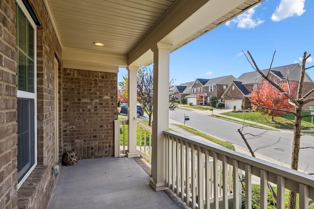 balcony with a residential view and covered porch