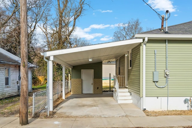 view of parking featuring a carport and fence