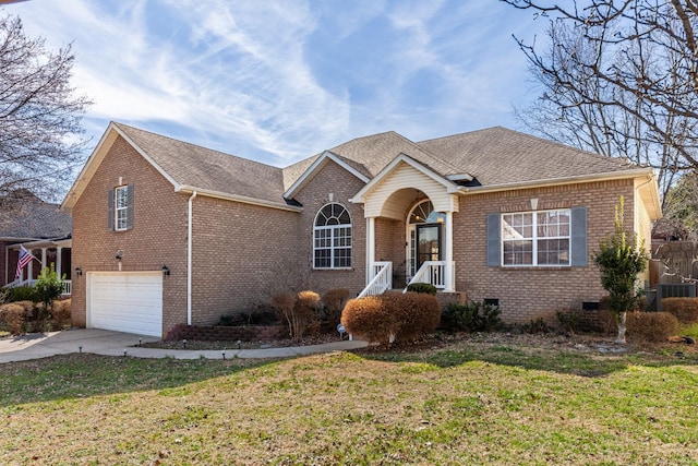 view of front of house with brick siding, concrete driveway, an attached garage, crawl space, and a front lawn