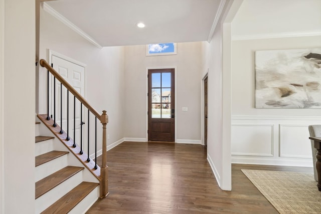 entryway with stairway, baseboards, ornamental molding, and dark wood finished floors