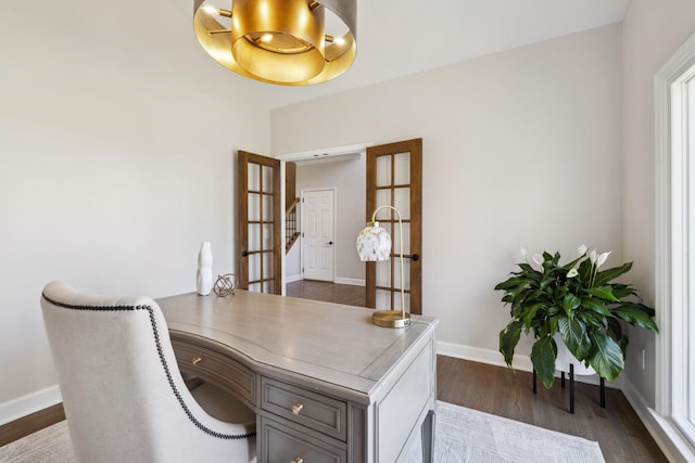 office area featuring dark wood finished floors and baseboards