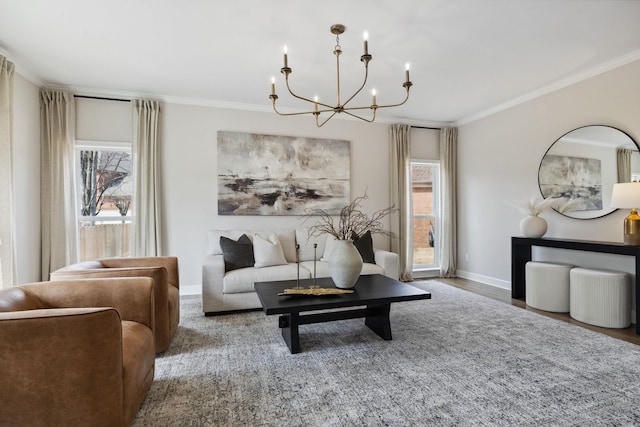 living room with a wealth of natural light, crown molding, and baseboards