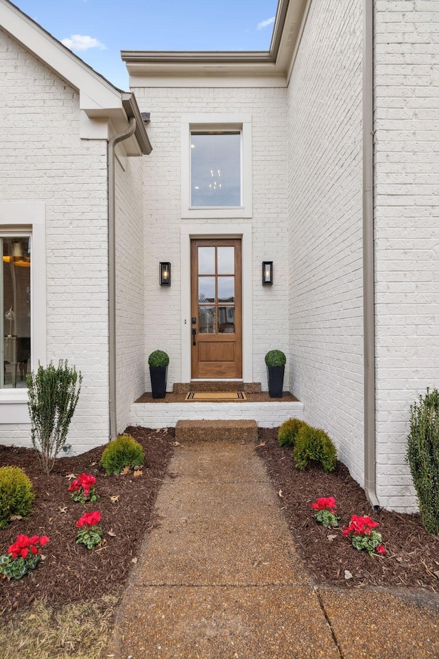 entrance to property with brick siding