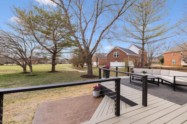 wooden deck featuring a yard and an outdoor hangout area