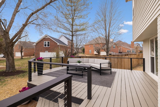 wooden terrace featuring a residential view and an outdoor hangout area