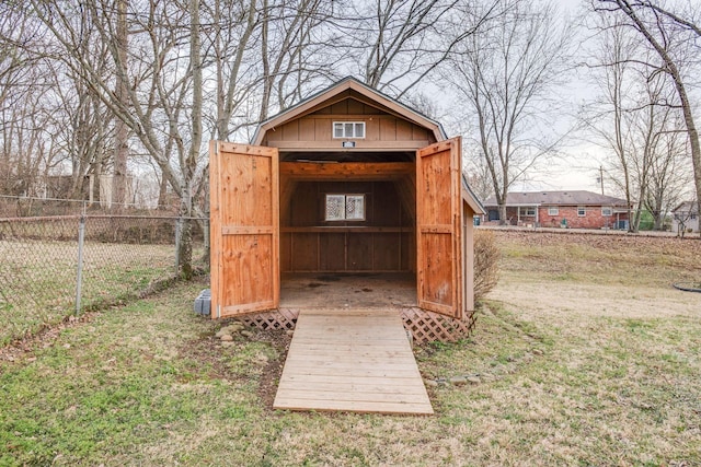 view of shed with fence