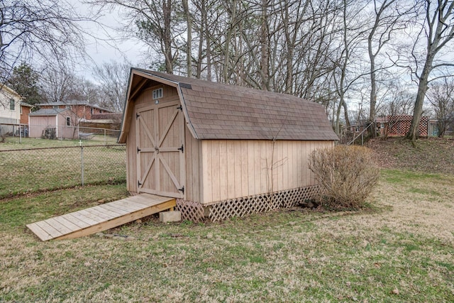 view of shed with fence