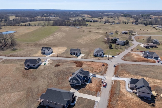 birds eye view of property with a rural view