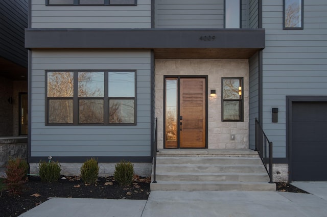 entrance to property featuring a garage