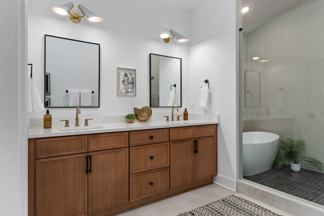 bathroom with double vanity, a soaking tub, a sink, and tile patterned floors