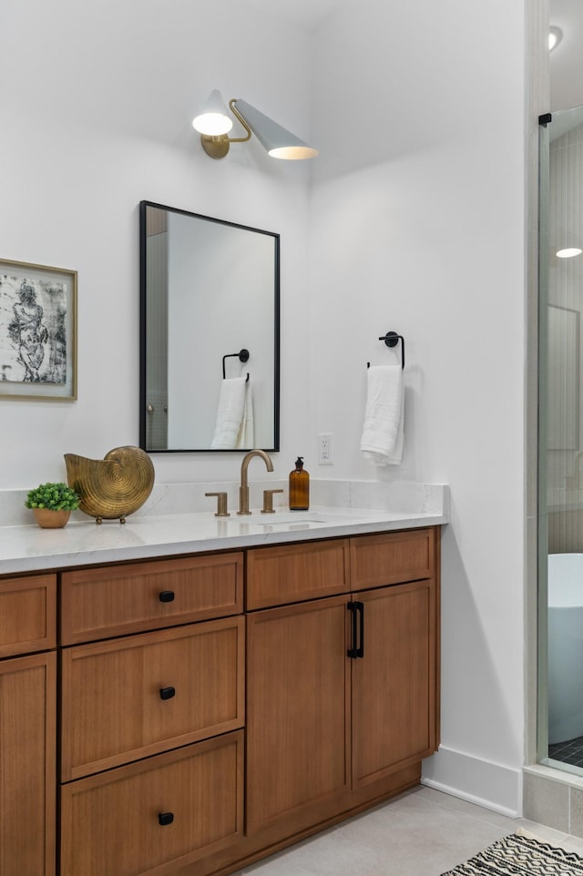 bathroom featuring baseboards and vanity