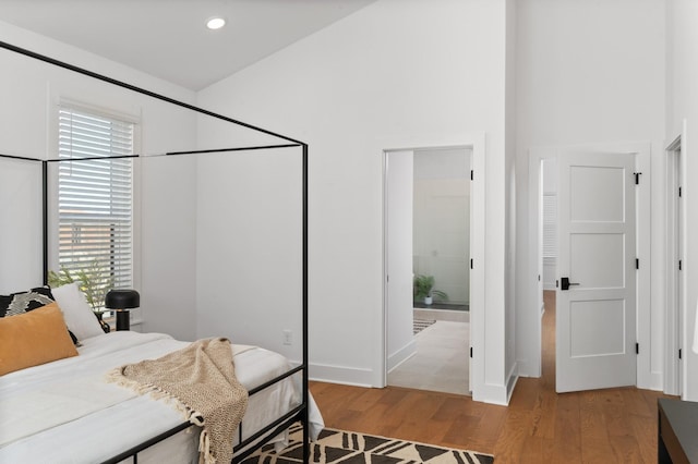 bedroom with recessed lighting and light wood finished floors