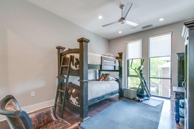 bedroom featuring recessed lighting, visible vents, a ceiling fan, wood finished floors, and baseboards