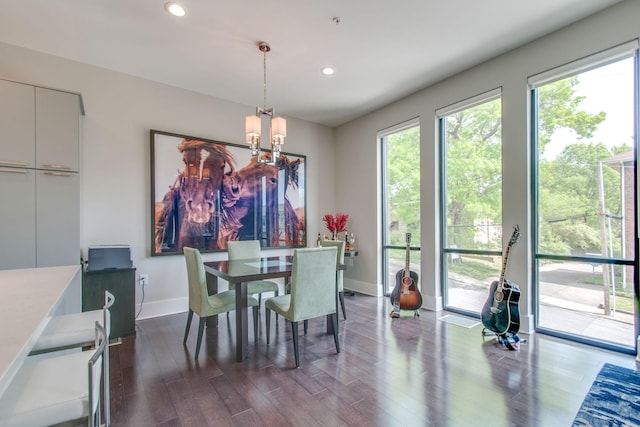 dining room featuring baseboards, dark wood finished floors, a wealth of natural light, and recessed lighting