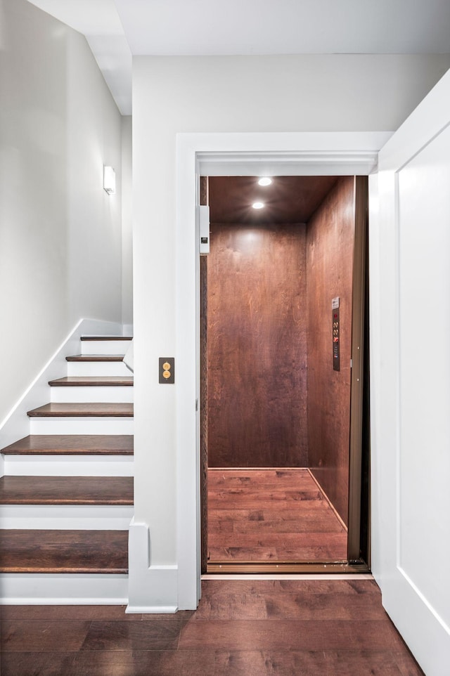 details with elevator and wood finished floors