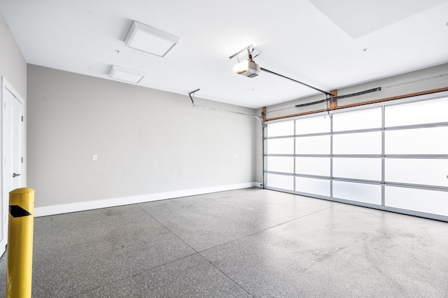 garage featuring baseboards and a garage door opener