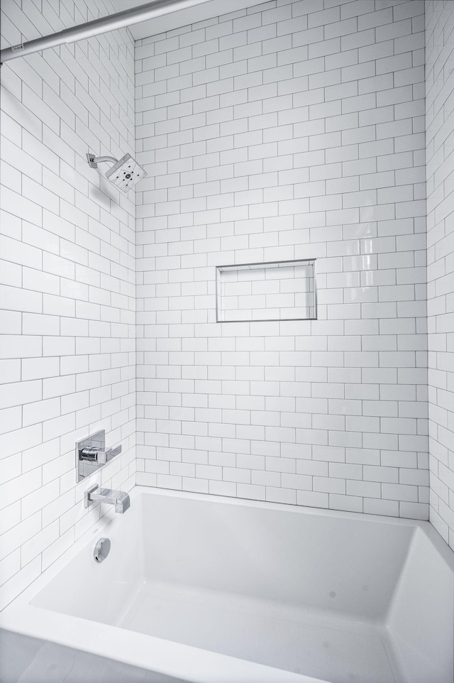 bathroom with shower / bathtub combination