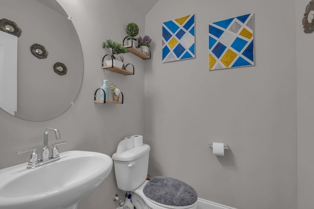 bathroom with a sink and toilet