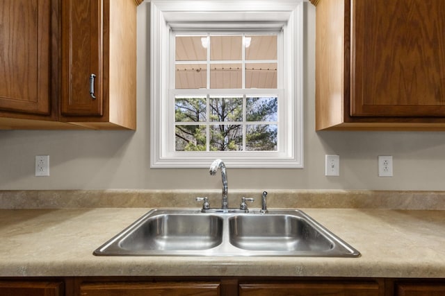 kitchen with light countertops and a sink