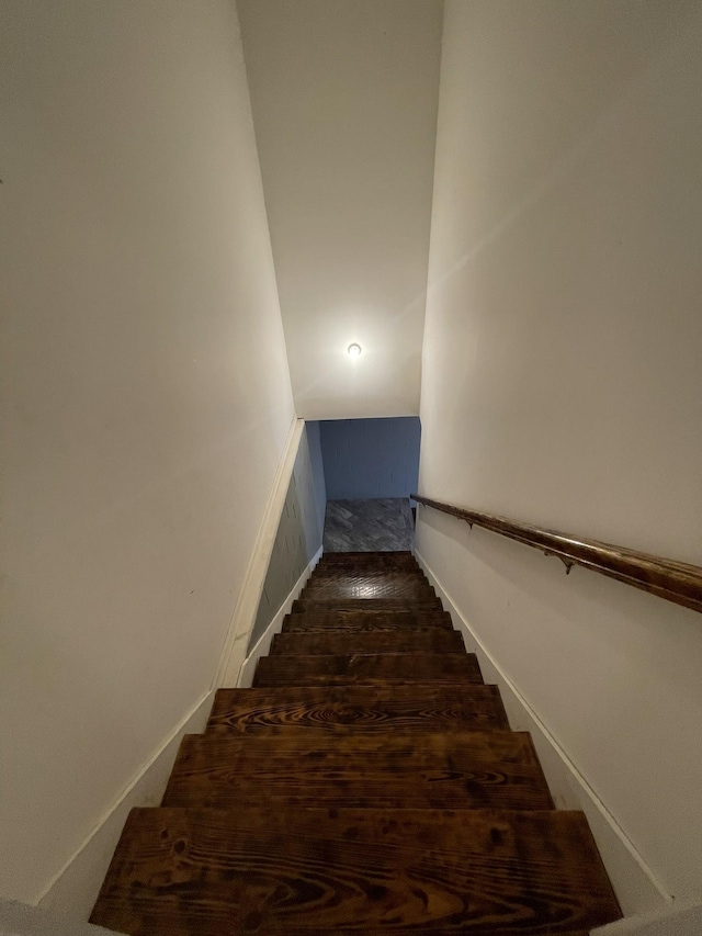 stairway featuring wood finished floors