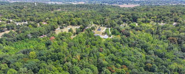 drone / aerial view featuring a forest view