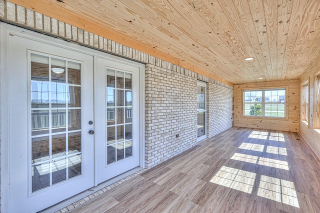 unfurnished sunroom featuring french doors and wooden ceiling