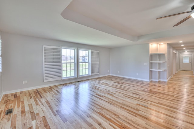 unfurnished room with light wood-style flooring, recessed lighting, a ceiling fan, visible vents, and baseboards