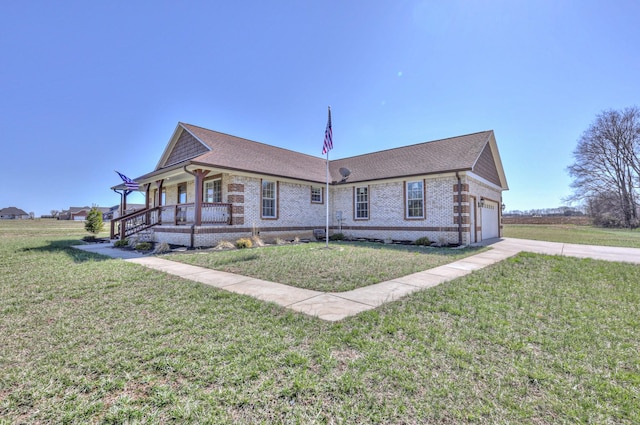 view of front facade featuring concrete driveway, roof with shingles, a front yard, a porch, and brick siding