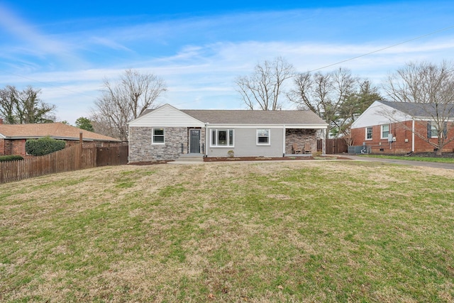 view of front of home featuring a front yard and fence