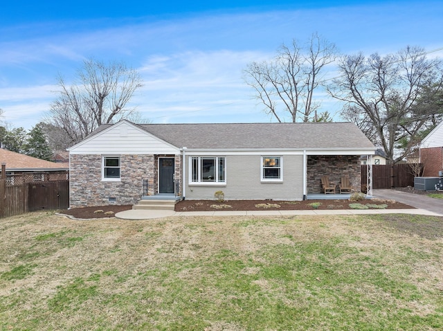 ranch-style house with roof with shingles, brick siding, a front yard, crawl space, and fence