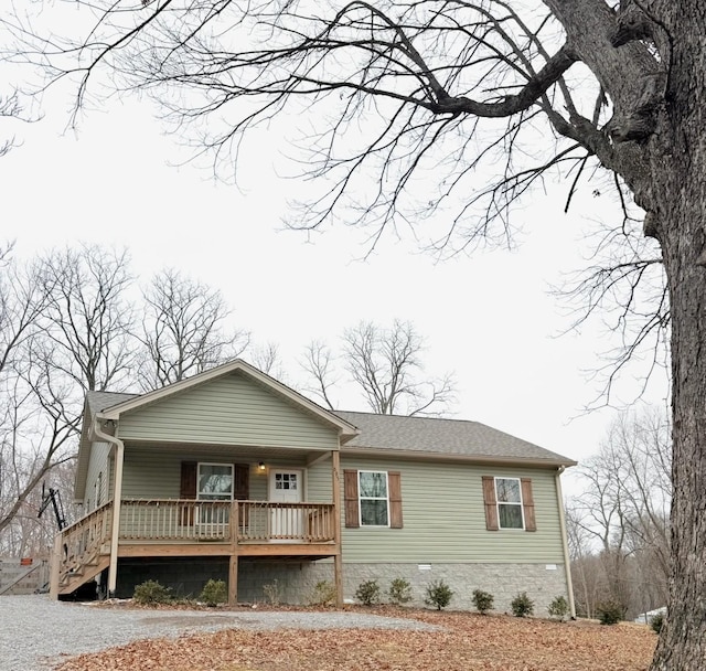 view of front of house featuring crawl space, a porch, and roof with shingles