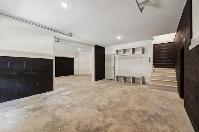 garage featuring recessed lighting and concrete block wall