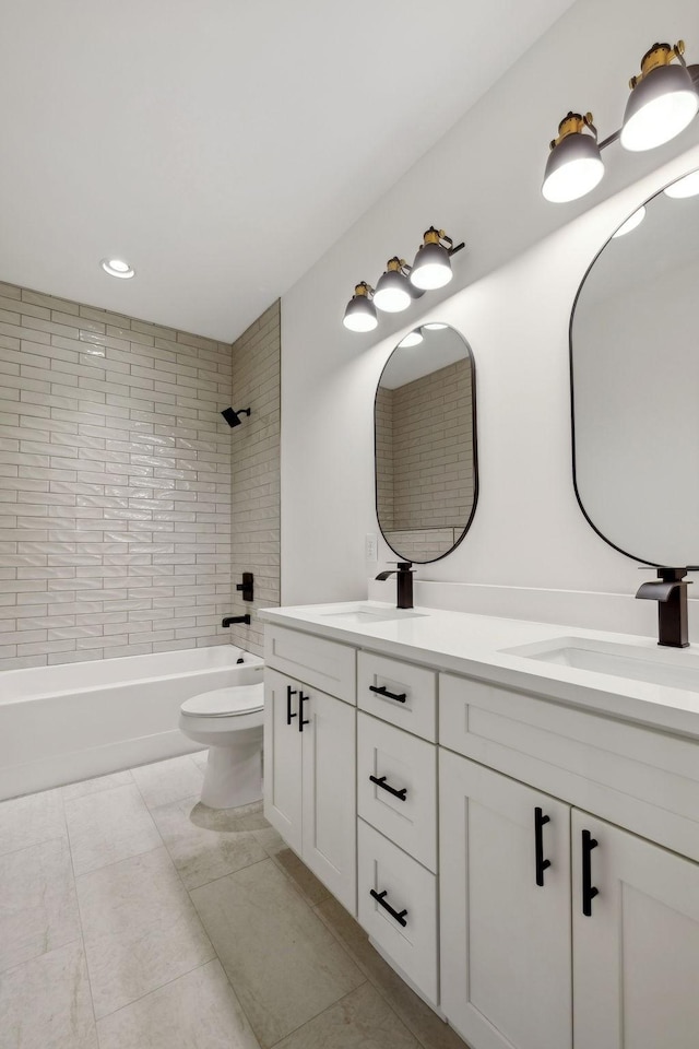 full bathroom featuring washtub / shower combination, a sink, toilet, and double vanity