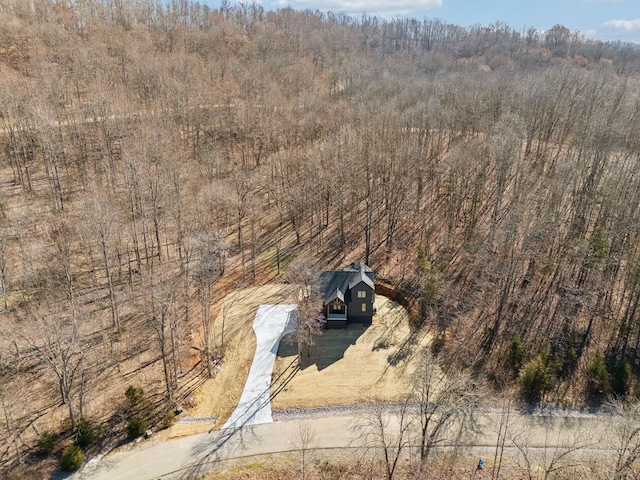 bird's eye view featuring a forest view