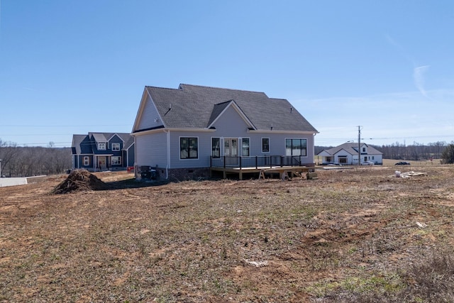 view of front of property featuring crawl space and a deck