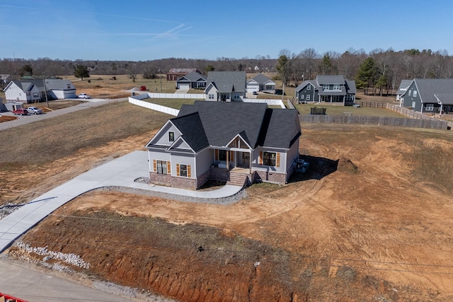 view of front of property featuring a residential view and fence