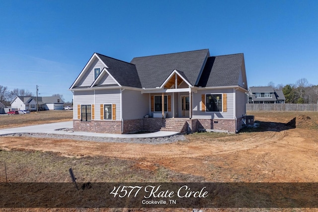 view of front of property with brick siding, fence, and central AC unit