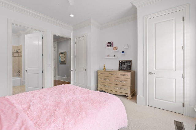 bedroom with visible vents, connected bathroom, ornamental molding, carpet floors, and recessed lighting