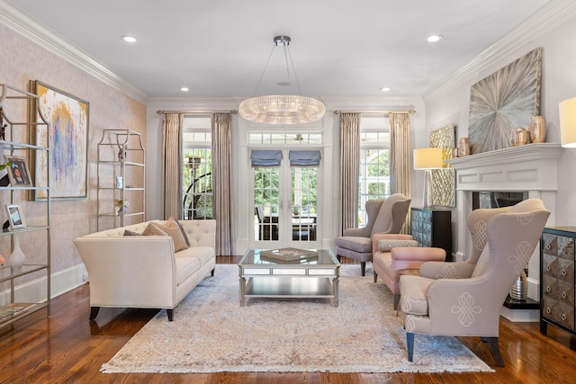 living room featuring a wealth of natural light, crown molding, and wood finished floors