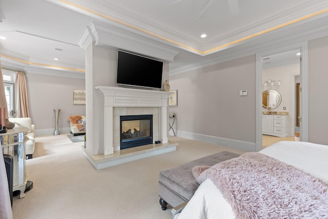 bedroom featuring baseboards, a raised ceiling, carpet floors, a fireplace, and recessed lighting