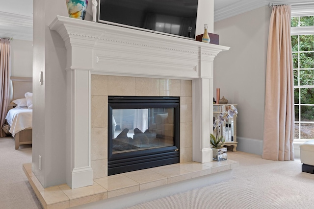 details with crown molding, a fireplace, baseboards, and carpet flooring