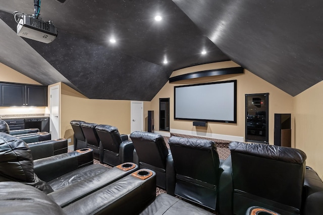 cinema room featuring lofted ceiling and recessed lighting