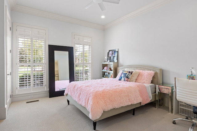 bedroom featuring carpet, multiple windows, visible vents, and crown molding