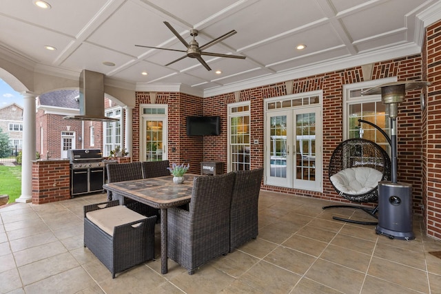 view of patio with french doors, grilling area, outdoor dining space, and a ceiling fan