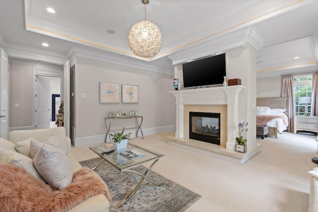 living area featuring baseboards, ornamental molding, carpet flooring, a fireplace, and recessed lighting